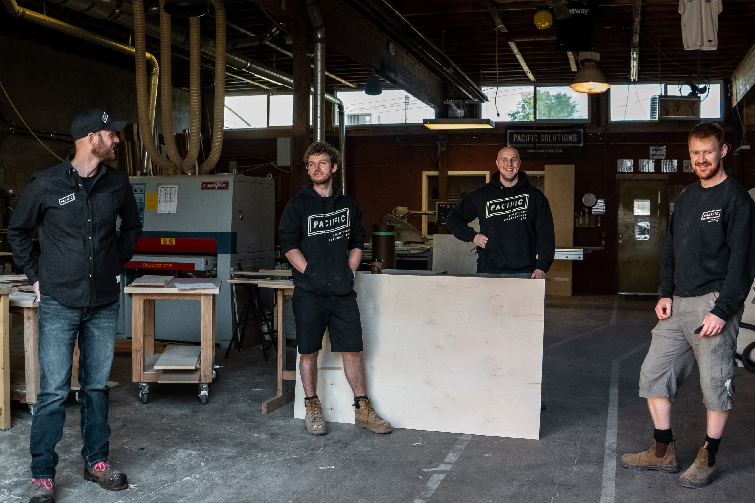 Pacific workshop crew standing in the millwork shop